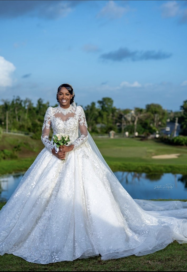 Bride in an elegant white wedding gown outdoors