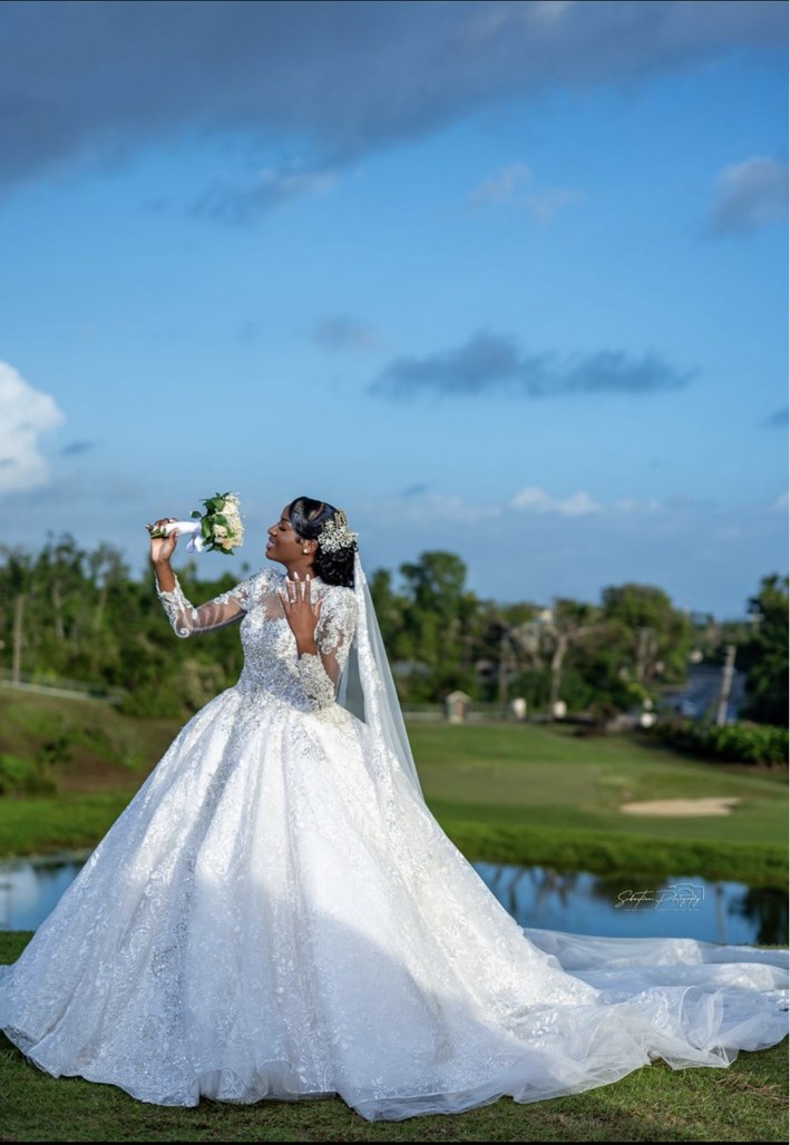 Bride holding flowers in her wedding gown